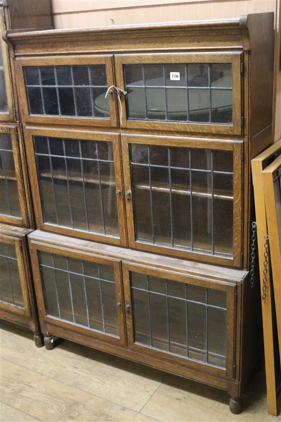 A Minty oak leaded glass bookcase W.89cm